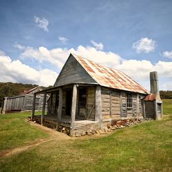 House on field against sky