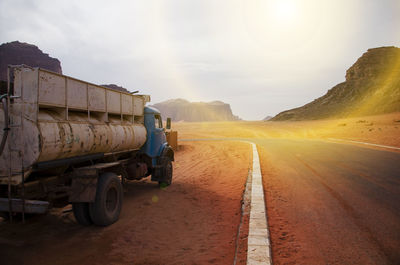 Cars on road against sky