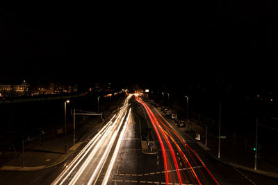 High angle view of light trails on road at night