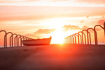 Scenic view of beach against sky during sunset