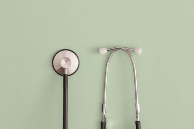 Stethoscope on green background. top view. flat lay. medicine concept.