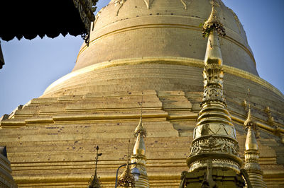 Low angle view of old building against blue sky