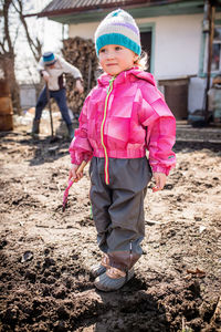 Full length of boy standing on field