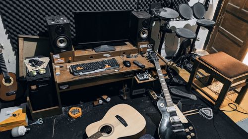 High angle view of guitar on table