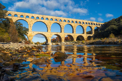 The pont du gard in autumn. ancient roman three-tiered aqueduct bridge. 