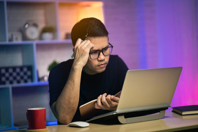 Man using laptop at home