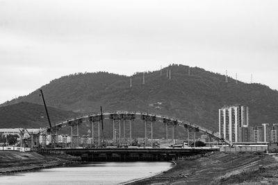 Bridge over river against sky
