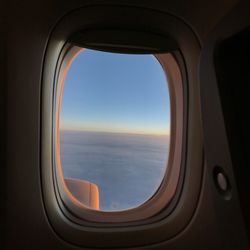 Scenic view of sea seen through airplane window