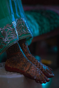 Low section of bride with henna tattoo