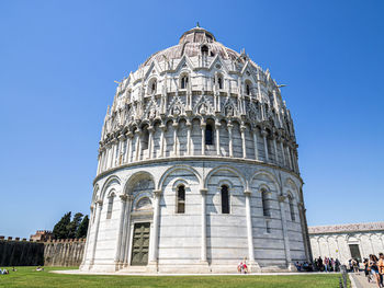 Low angle view of historical building against blue sky