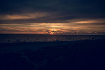 Scenic view of sea against sky at sunset