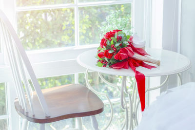 Flower vase on table at home