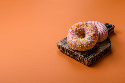 High angle view of donut on yellow background