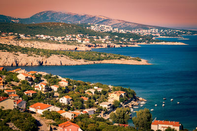 High angle view of townscape by sea