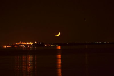 Scenic view of sea against sky at night