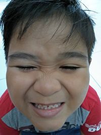 Close-up portrait of smiling boy