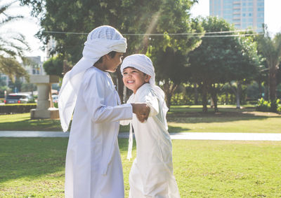 Rear view of couple standing outdoors