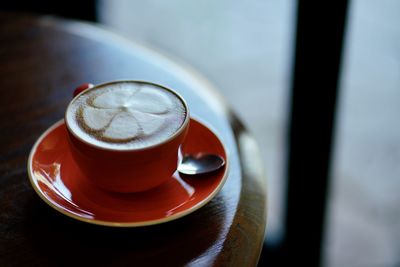 High angle view of coffee cup on table