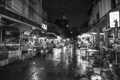 View of wet street at night