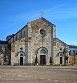 Exterior of historic building against blue sky