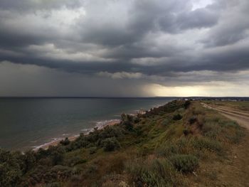 Scenic view of sea against cloudy sky