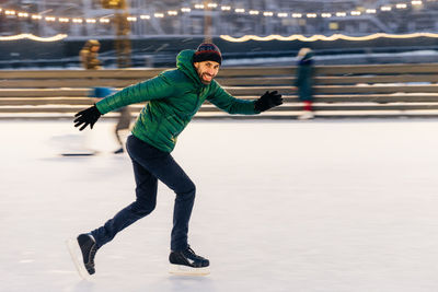 Full length of senior woman in snow