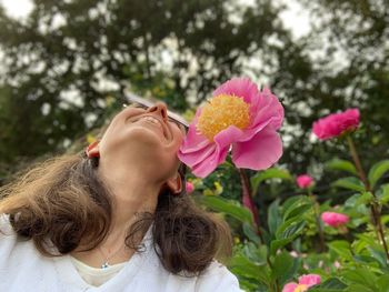 Portrait of woman with pink flowers