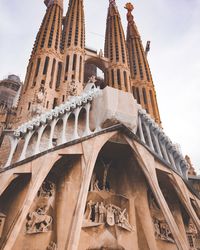 Low angle view of sagrada familia against sky