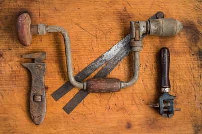 Directly above shot of metal equipment on wood