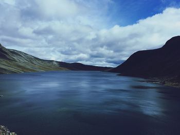 View of lake against cloudy sky