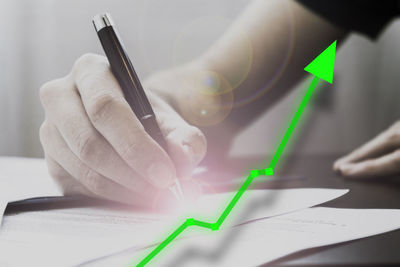 Close-up of human hand holding paper