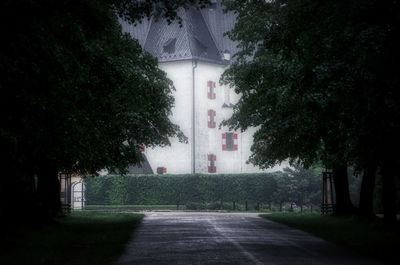 Street amidst trees and buildings in city