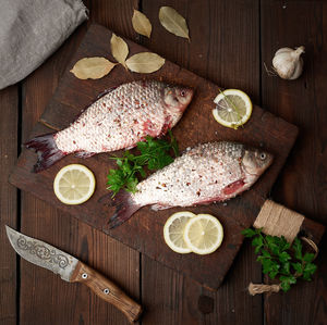 High angle view of fish on cutting board