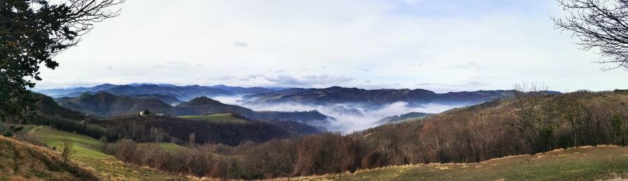 Scenic view of landscape and mountains against sky