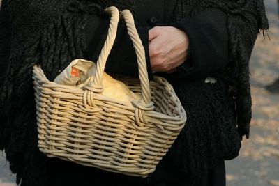 Midsection of man working in basket