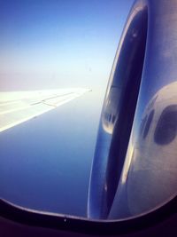 Close-up of airplane wing against clear sky