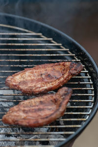 High angle view of meat on barbecue grill