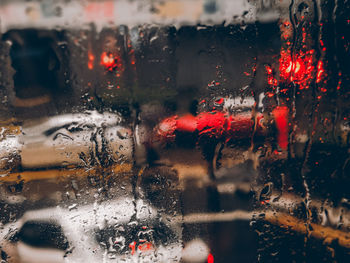 Full frame shot of wet glass window in rainy season