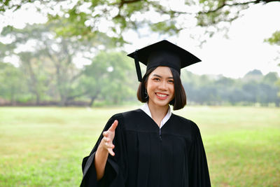 Portrait of a smiling young woman standing outdoors