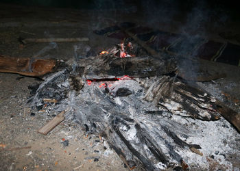 High angle view of fire on wood