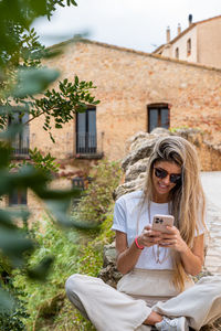 Young woman using mobile phone