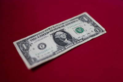 Close-up of paper currency on red background