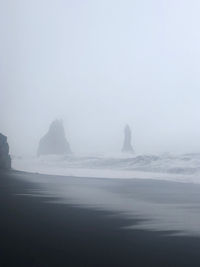 Scenic view of sea against sky during foggy weather