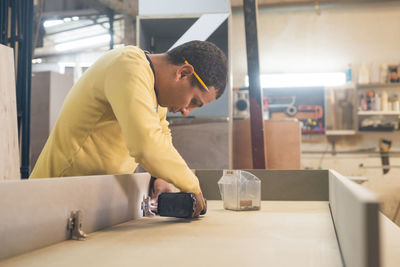 Carpenter working in workshop