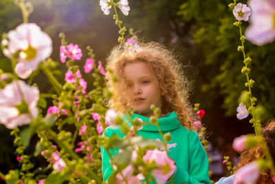 Portrait of girl with pink flowers