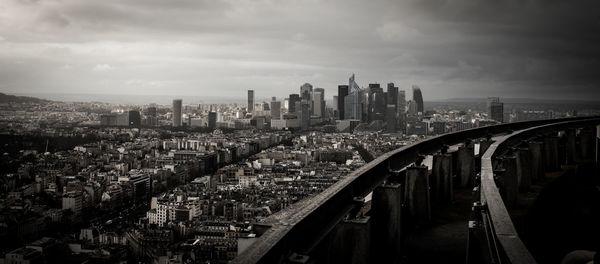 High angle view of modern buildings in city against sky
