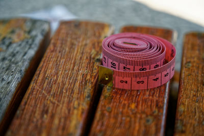Close-up of rolled tape measure on table