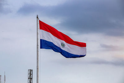 Low angle view of flag against sky