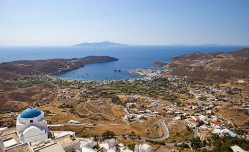 The port and beach town of livadi is viewed from the chora of serifos