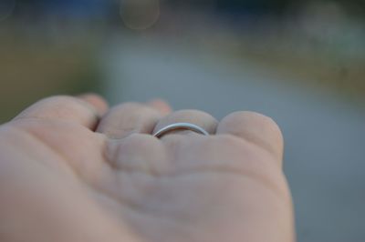 Cropped hand of person wearing ring